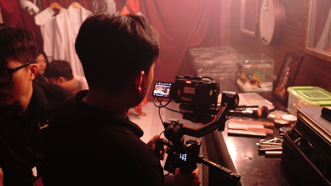 Backstage view of a television set with crew and equipment